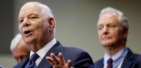 FILE PHOTO: U.S. Senator Senator Ben Cardin (D-MD)  (D-MD) and Sen. Chris Van Hollen (D-MD), as he delivers introductory remarks before U.S. President Joe Biden was scheduled to speak about his economic agenda at Prince George's Community College in Largo, Maryland, U.S. September 14, 2023. REUTERS/Jonathan Ernst/File Photo