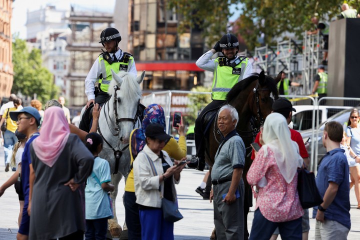 Mounted police are seen on patrol at Leicester Square, in London, Britain, August 13, 2024. REUTERS/Hollie Adams